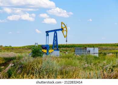 Old Pump Jack At Field. Petroleum And Gas Industry