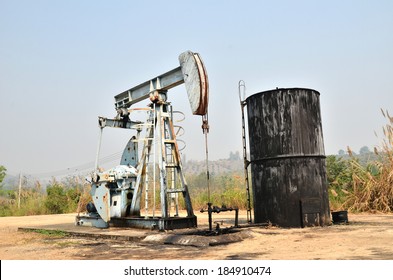 Old Pumpjack Pumping Crude Oil From Oil Well