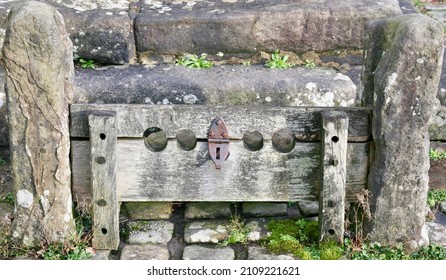 The old punishment stocks in the centre of the village, Great Britain, Europe