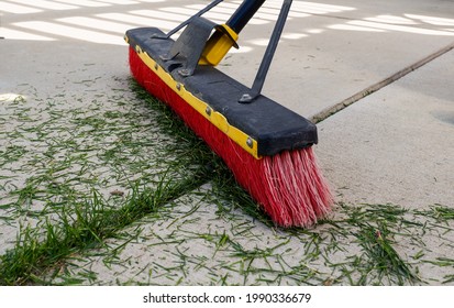 Old Push Broom Sweeping Grass Clippings Off Patio 