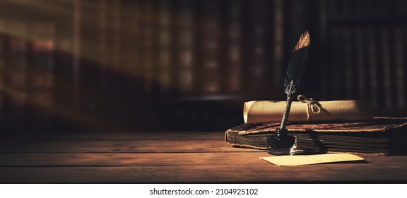 old quill pen with inkwell and papers on wooden desk against vintage bookcase. retro style. banner copy space - Shutterstock ID 2104925102