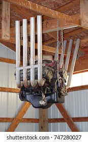 Old Racing Car V 8 Engine Hanging From Rafter In A Barn