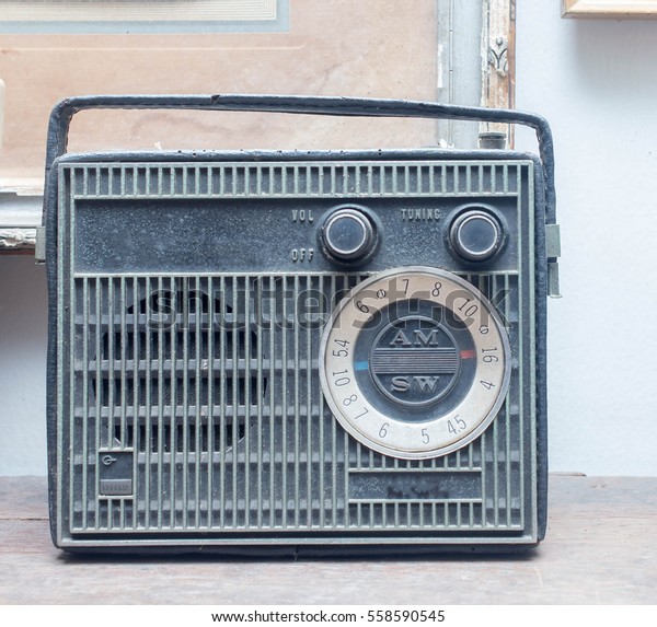 Old radio on the\
background of a divide.