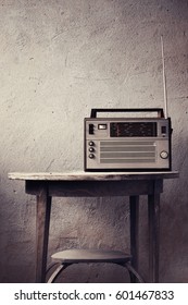 Old radio on rustic background in vintage color
