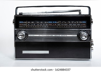 Old radio on white background. Radio antenna. Broadcast object. Minimalism background. Radio broadcasting. Musical record. Retro music. Vintage decorative element.