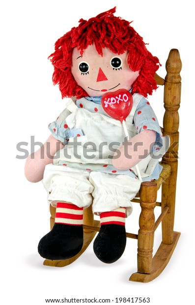 doll sitting in chair