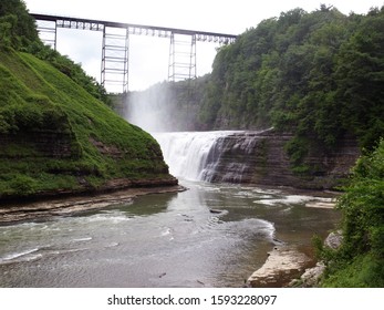 Old Railroad Bridge On Top Of The Water Falls At Letchworth State Park, Upstate NY, USA