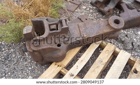 An Old Railroad Coupler Casting on a Pallet