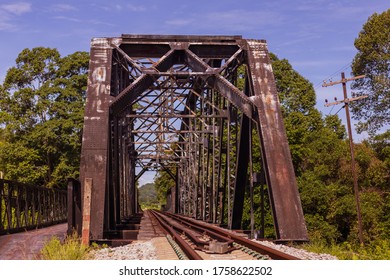 The Old Railway Bridge Is Made Of Steel For Over 70 Years, Rust And Dirty. Located In Southeast Asia