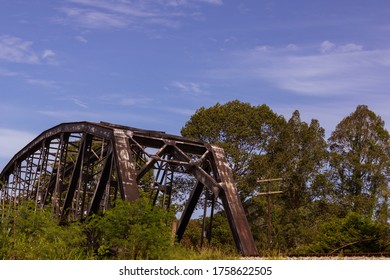 The Old Railway Bridge Is Made Of Steel For Over 70 Years, Rust And Dirty. Located In Southeast Asia