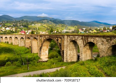 Old railway bridge, old viaduct Vorohta, Ukraine. Carpathian Mountains, wild mountain landscape - Shutterstock ID 703918717