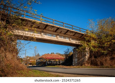 Old Railway Concrete bridge over a rural road during autumn - Powered by Shutterstock