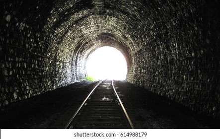 Old railway tunnel and bright light at the end