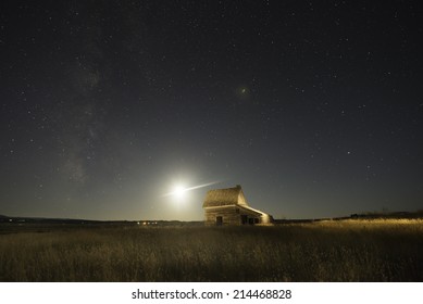 Old Ranch House In Belle Fourche, South Dakota With Night Sky Filled With Stars.