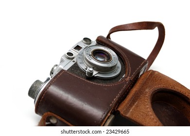 Old rangefinder vintage camera in a leather case against white