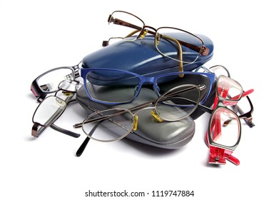 Old Reading Glasses And Glass Cases On A White Background 