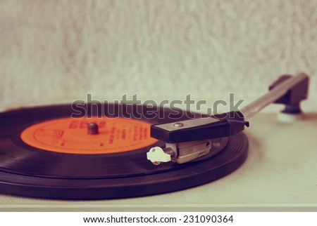 old record player, image is retro filtered. selective focus