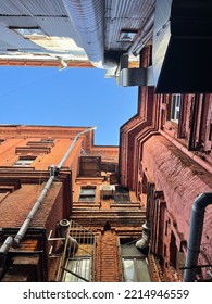 Old Red Brick Building In The City, View From Below