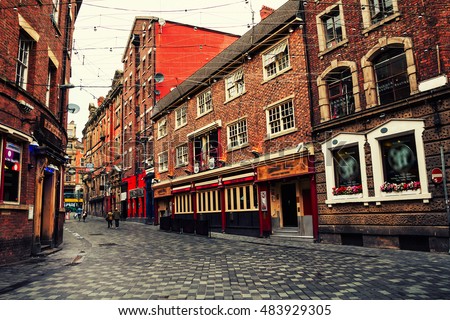 Old red brick buildings in the city center of Liverpool, UK. Restaurants, bars and shops. Vintage street