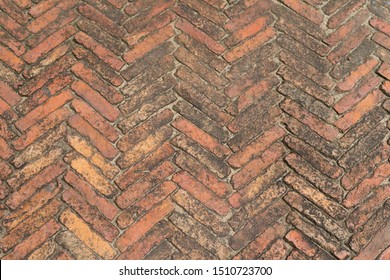 Old Red Brick Floor Or Walkway,Bring Bricks Arrange To Chevron Or Zigzag  Pattern.