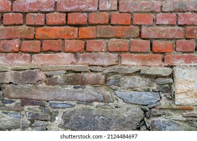 Old Red Brick Wall Background Texture. Dirty Rough Backdrop Of A Building Facade. Pattern Of Small Weathered Masonry Structure. Vintage House Exterior With Different Stone Materials.