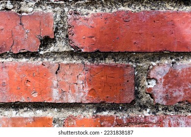 Old red brick wall on a Victorian residential property with cracks and mould background texture - Shutterstock ID 2231838187