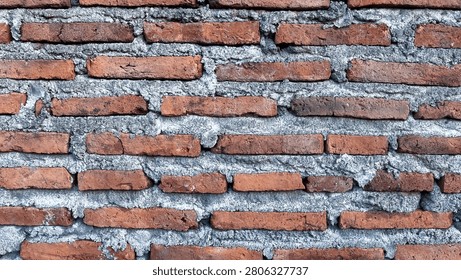 Old Red Brick Wall Texture with Rough Cement Mortar Background