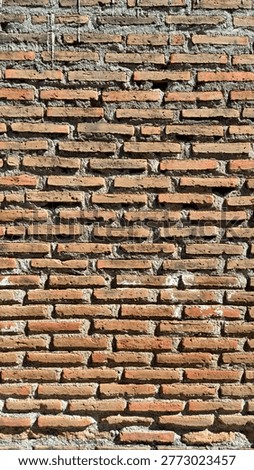 Old Red Brick Wall Texture with Rough Cement Mortar atau Vintage Brickwork Background for Industrial Design Rustic Clay Brick Wall Pattern with Hard Shadows