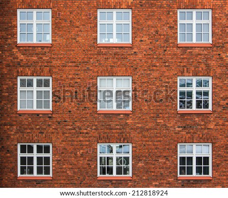 Old red brick wall with windows in Helsinki, Finland