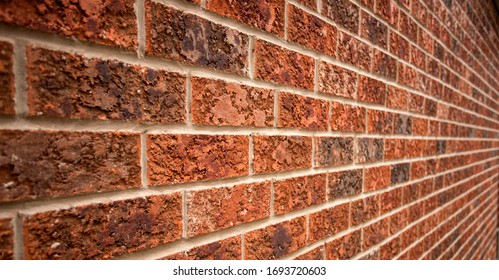Old red bricked wall with leading lines. Perspective of leading lines in old red wall of a house. - Shutterstock ID 1693720603