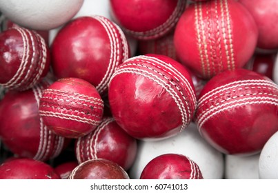 old, red cricket balls