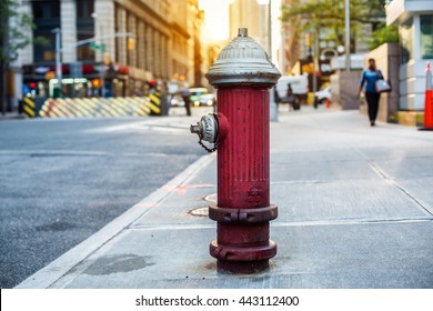 Old red fire hydrant in New York City street. Fire hidrant for emergency fire access