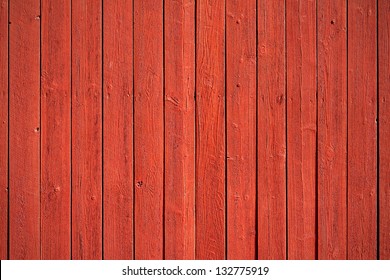 Old, red grunge wood vertical panels on a rustic barn - Shutterstock ID 132775919