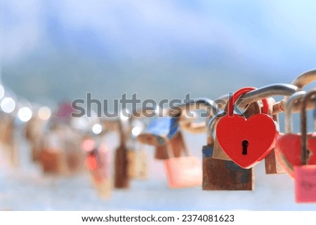 Old red heart shaped lock. Love lock on the bridge. Close up of lock and key hole. Red love padlock. Valentines day. Makarska Croatia. Red metal padlock heart of lovers. Greeting card 