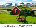 Old red hut with turf roof in Iceland