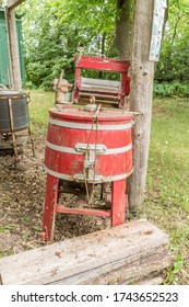 old red painted washing machine