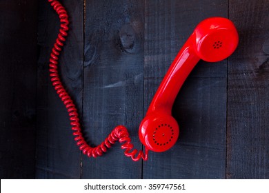 Old Red Phone Cable On Wooden Background