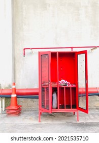 An Old Red Safety Locker Is Open. There Was An Old Traffic Cone On The Side.