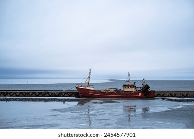 Old red ship in a frozen harbour in the baltic sea with copy space - Powered by Shutterstock