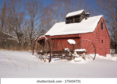 An Old Red Sugar House On A Farm In New England In The Snow.