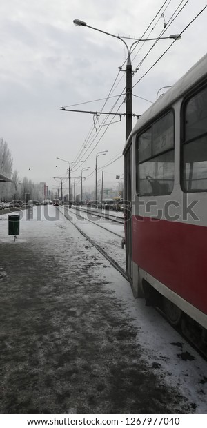 Old red tram. Winter. Tram
stop.