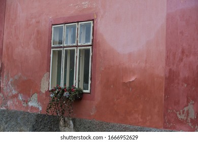 Old red wall with window