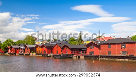 Old red wooden houses on the river coast, Porvoo town, Finland