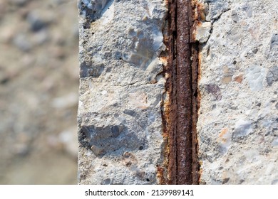 Old reinforced concrete structure with damaged and rusty metallic reinforcement that must be demolished - Metal bars rusty due to water infiltration into concrete 