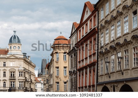 Old residential buildings in Mala Strana district of Prague. View against cloudy sky