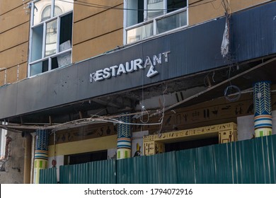 An old restaurant sign with one of the letters broken