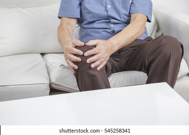 Old Retired Gentleman With Chronic Knee Problems And Pain