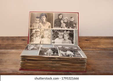 old retro album with vintage monochrome photographs in sepia color, taken in 1955-1960, concept of genealogy, the memory of ancestors, family ties, childhood memories