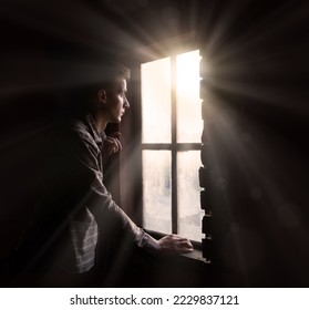 Old retro antique life young teen age frown boy guy face feel guilt light sky view. ancient lost tire guilty human cry ask belief god lord Christ love faith hand dark black room text space war concept - Shutterstock ID 2229837121