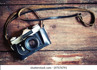 Old retro camera vintage wooden boards abstract background